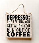 wood sign saying DEPRESSO: That Feeling You Get When You Run Out Of Coffee