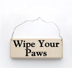 wood sign saying Wipe Your Paws