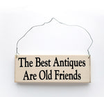 wood sign saying The Best Antiques Are Old Friends