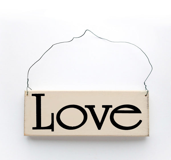 wood sign saying Love