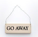 wood sign saying Go Away