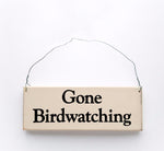 wood sign saying Gone Birdwatching