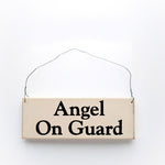 wood sign saying Angel On Guard