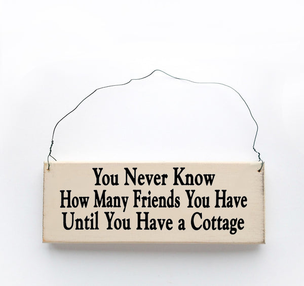 wood sign saying You Never Know How Many Friends You Have Until You Have a Cottage