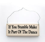 wood sign saying If You Stumble, Make It Part Of The Dance