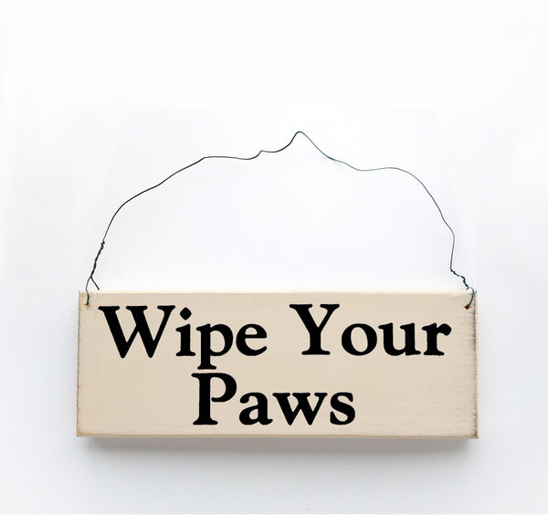wood sign saying Wipe Your Paws
