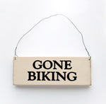 wood sign saying Gone Biking