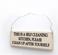 wood sign saying This is a Self Cleaning Kitchen, Please Clean Up After yourself