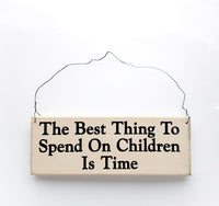 wood sign saying The Best Thing to Spend on Children is Time