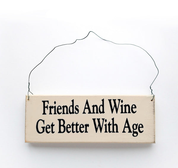 wood sign saying Friends and Wine Get Better With Age