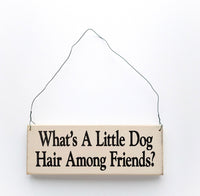 wood sign saying What's a Little Dog Hair Among Friends