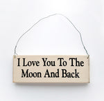 wood sign saying I Love You to the Moon and Back