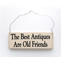 wood sign saying The Best Antiques Are Old Friends