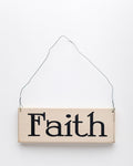 wood sign saying Faith