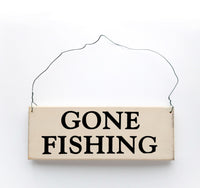 wood sign saying Gone Fishing