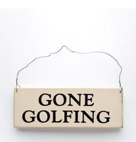 wood sign saying Gone Golfing