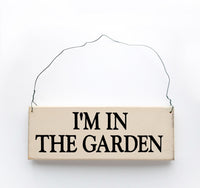 wood sign saying I'm in the Garden
