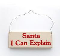 wood sign saying Santa I Can Explain