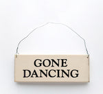 wood sign saying Gone Dancing