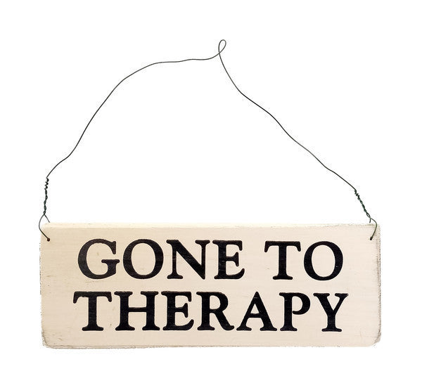 wood sign saying Gone To Therapy