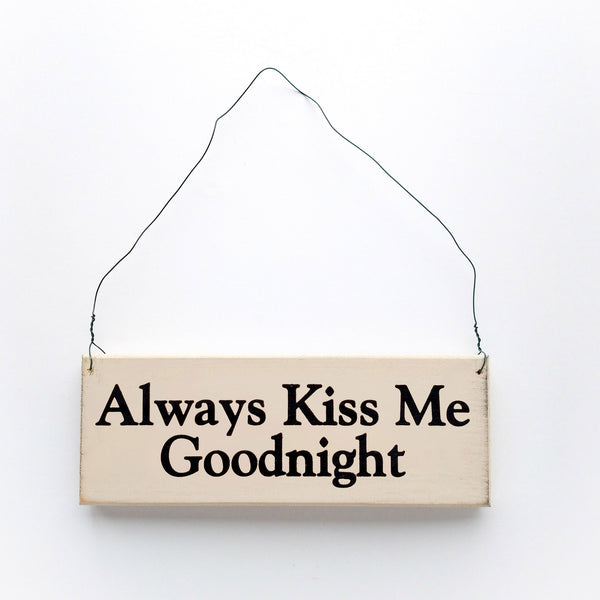 wood sign saying Always Kiss Me Goodnight