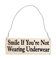 wood sign saying Smile if You're Not Wearing Underwear