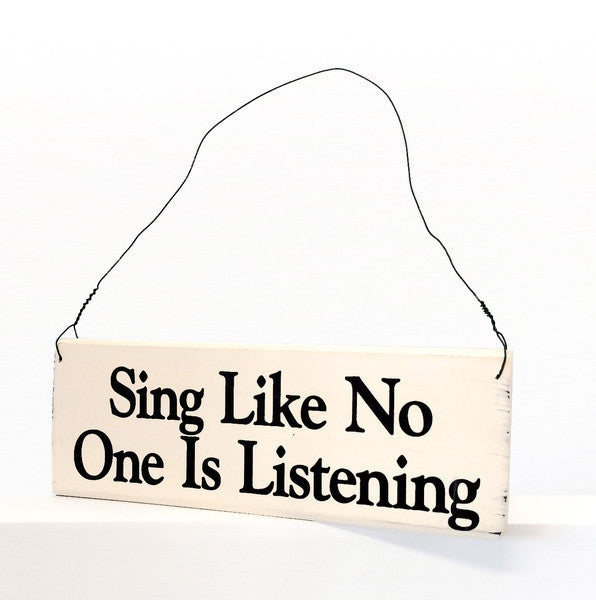 wood sign saying Sing Like No One is Listening