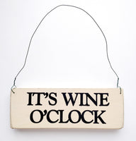 wood sign saying It's Wine O’ Clock