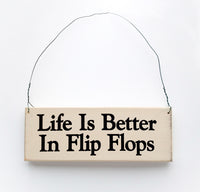 wood sign saying Life Is Better In Flip Flops