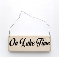 wood sign saying On Lake Time